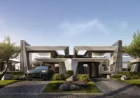 Fachada de casas modernas com paisagismo e carros na garagem — Navagio Life Homes