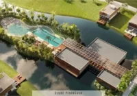 Vista aérea do clube península com piscinas e casas ao redor — Condomínio Raro
