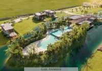 Vista aérea do condomínio Raro com clube península e casas à beira d'água